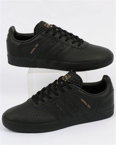 adidas black sneakers mens|black trainers men's size 13.